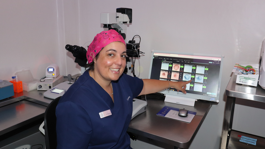 Embryologist Carolina Cordero with Chloe in the Tambre IVF laboratory.